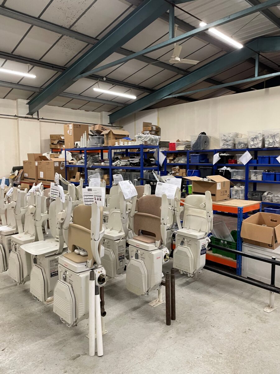 A warehouse with stairlifts stored