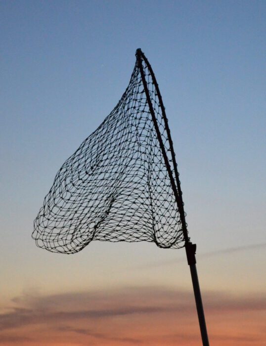 Fishing net against a sunset