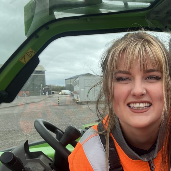 Megan in hi-vis at work outside